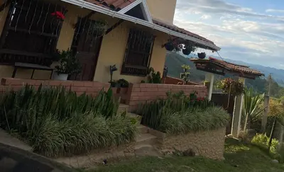 a house with some plants in front of it at Casa Finca en el Peñol in Piedra El Marcial