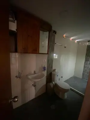 a bathroom with a toilet and a sink at Casa Finca en el Peñol in Piedra El Marcial