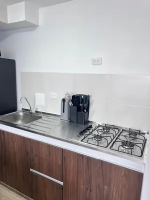 a kitchen with a stove top and a sink at Apartamento en Manizales Montaña & Café in Estación El Salto