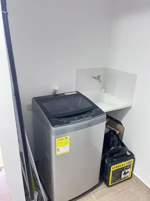 a refrigerator with a trash can in a room at Apartamento en Manizales Montaña & Café in Estación El Salto