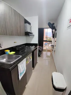 a kitchen with a sink and a counter top at Apartamento loft amoblado Medellin in Medellín