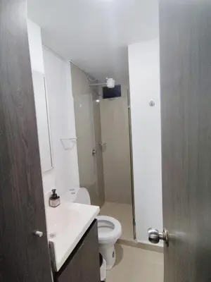 a bathroom with a toilet and a sink and a shower at Apartamento loft amoblado Medellin in Medellín
