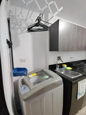 a small kitchen with a sink and a sink at Apartamento loft amoblado Medellin in Medellín