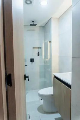 a bathroom with a toilet and a glass shower at New Apartment in Laureles, Modern & Total Comfort in Medellín