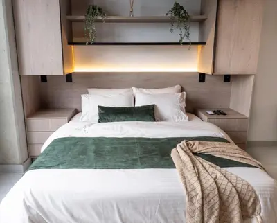 a bedroom with a large white bed with white pillows at New Apartment in Laureles, Modern & Total Comfort in Medellín
