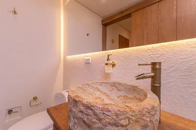a bathroom with a sink with a marble counter at Casa Museo Living by HOUSY in Medellín