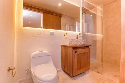 a bathroom with a toilet and a shower at Casa Museo Living by HOUSY in Medellín