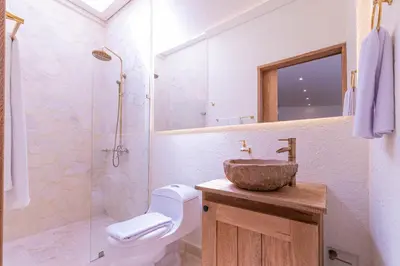 a bathroom with a sink and a toilet and a shower at Casa Museo Living by HOUSY in Medellín
