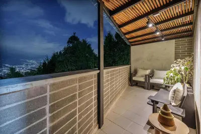 an outdoor balcony with a view of the city at Medellin Sky Penthouse in Envigado