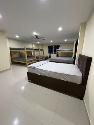 a bedroom with two beds in a room at Finca Villa Sofía in Santa Fe de Antioquia