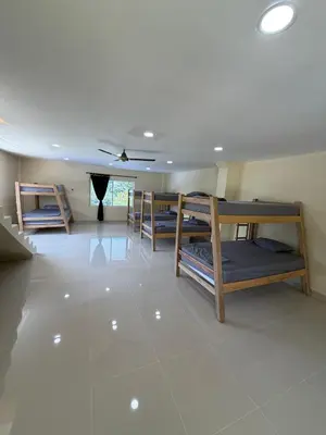 a room with several bunk beds in it at Finca Villa Sofía in Santa Fe de Antioquia