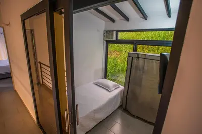 a small room with a bed and a window at Casa Finca Moderna en Sopetran, Antioquia in Sopetran