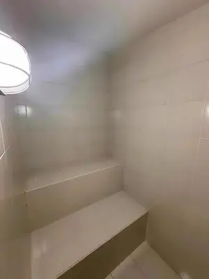 a white room with a shelf and a light at Cómoda Habitación condominio, wifi, piscina in Medellín