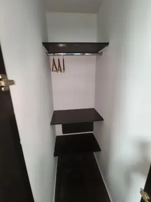 a staircase in a room with a sign on the wall at Hotel LAS MARIANA'S in Medellín