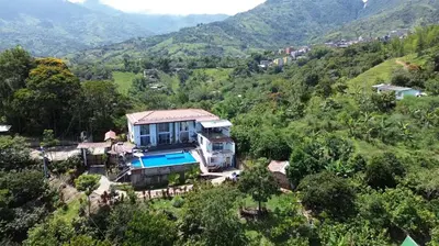an aerial view of a house on a hill at Finca La Catana, Naturaleza y Tranquilidad in Cocorná