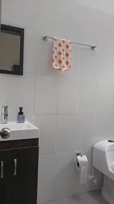 a bathroom with a sink and a toilet and a mirror at Finca La Catana, Naturaleza y Tranquilidad in Cocorná