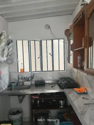 a kitchen with a sink and a window in it at Alojamiento Ríonegro in Rionegro