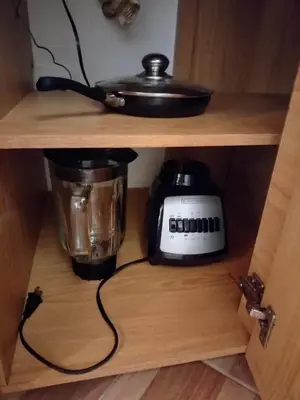 a cabinet with a slow cooker and a blender at Diseño natural y espacioso, vista panorámica de Medellín 501 in Medellín