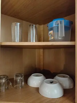 a wooden shelf with bowls and cups on it at Diseño natural y espacioso, vista panorámica de Medellín 501 in Medellín