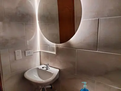 a bathroom with a sink and a mirror at Diseño natural y espacioso, vista panorámica de Medellín 501 in Medellín