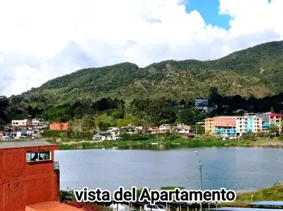 a view of a city and a body of water at Guatape linda vista in Guatapé