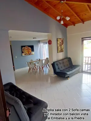a living room with a couch and a table at Guatape linda vista in Guatapé