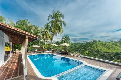 a swimming pool on the deck of a villa at Hotel Casa Encanto in Doradal