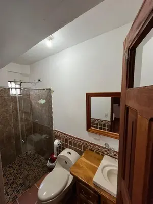 a bathroom with a toilet and a sink and a shower at Hotel San Joaquin Jerico in Jericó