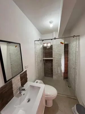 a bathroom with a toilet and a sink and a shower at Hotel San Joaquin Jerico in Jericó