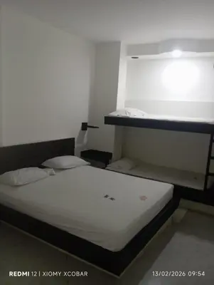 a bedroom with two bunk beds in a room at Hotel eden centro in Medellín