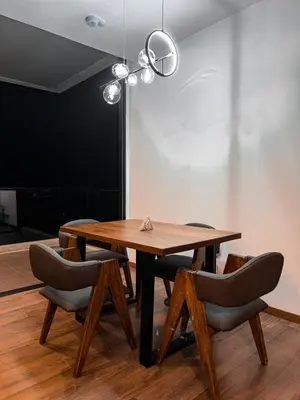 a dining room with a wooden table and chairs at Luxury Country Suite in Retiro, Antioquia in El Retiro