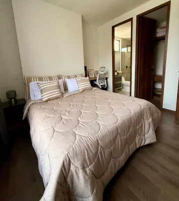 a bedroom with a large bed in a room at Luxury Country Suite in Retiro, Antioquia in El Retiro