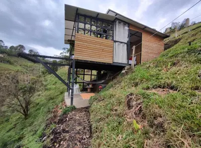 a house on the side of a hill at Glamping con vista de lujo in Guatapé