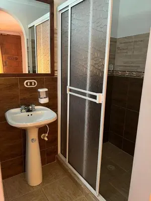 a bathroom with a sink and a shower at Finca villa mia in Girardota