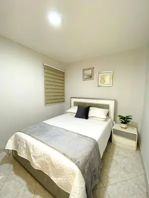 a bedroom with a large white bed in a room at Apartamento comodo, 3 Hab, cerca Poblado in Medellín