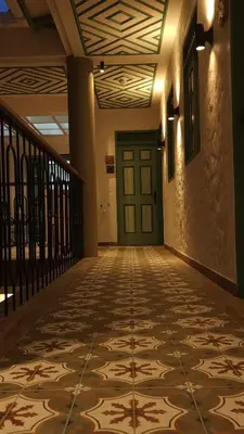 an empty hallway with a door and a tile floor at Hotel Boutique Paraíso Plaza Aguadas in Aguadas