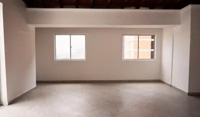 an empty room with two windows and a tile floor at 804- APTO 3BR a Pasos del Parque de Sabaneta in Sabaneta
