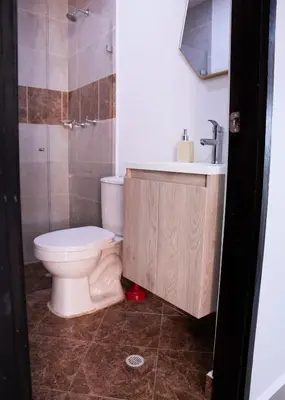 a bathroom with a toilet and a sink at 804- APTO 3BR a Pasos del Parque de Sabaneta in Sabaneta