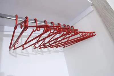a red metal object sitting on top of a table at Luzor Apartments in Medellín