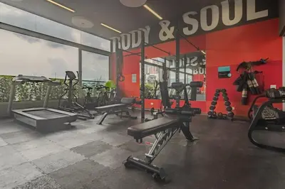 a gym with treadmills and machines in a room at Luxury Studio El Poblado City View 7th Floor in Medellín