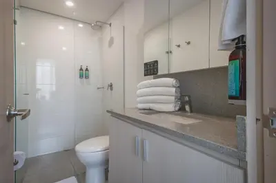 a bathroom with a toilet and a sink and a shower at Luxury Studio El Poblado City View 7th Floor in Medellín