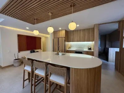 a kitchen with a large white island in a room at Arroyuelos in Estación El Salto