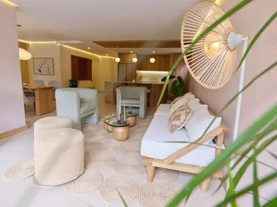 a living room with a couch and chairs and a table at Arroyuelos in Estación El Salto