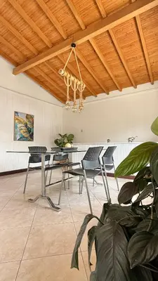 a dining room with a table and chairs and a ceiling at Private room Laureles, Estadio, la 70 Fast WIFI in Medellín