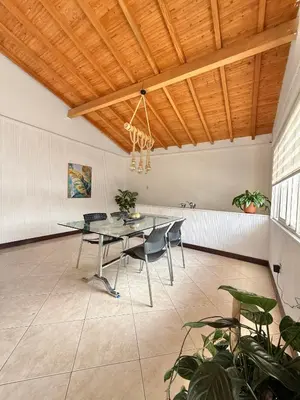 a dining room with a table and chairs at Private room Laureles, Estadio, la 70 Fast WIFI in Medellín