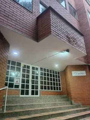 a building with stairs in front of a building at Cozy studio in Conquistadores in Medellín