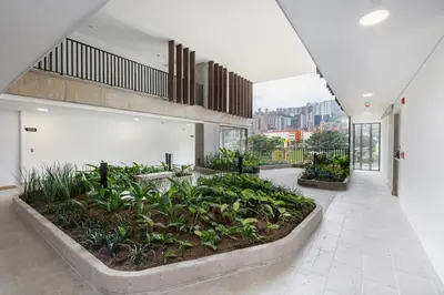 a large room with plants in a building at DISTRITO v in Estación El Salto