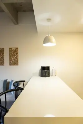 a room with a table with a toaster on it at Incredible new apartment in Envigado for six people in Envigado