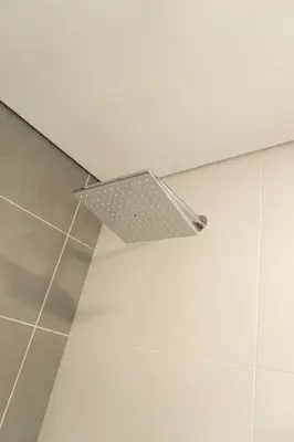 a light fixture on the ceiling of a bathroom at Incredible new apartment in Envigado for six people in Envigado