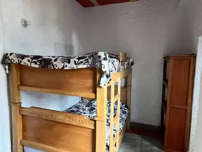 a couple of bunk beds in a room at Hotel Montañitas in Guatapé